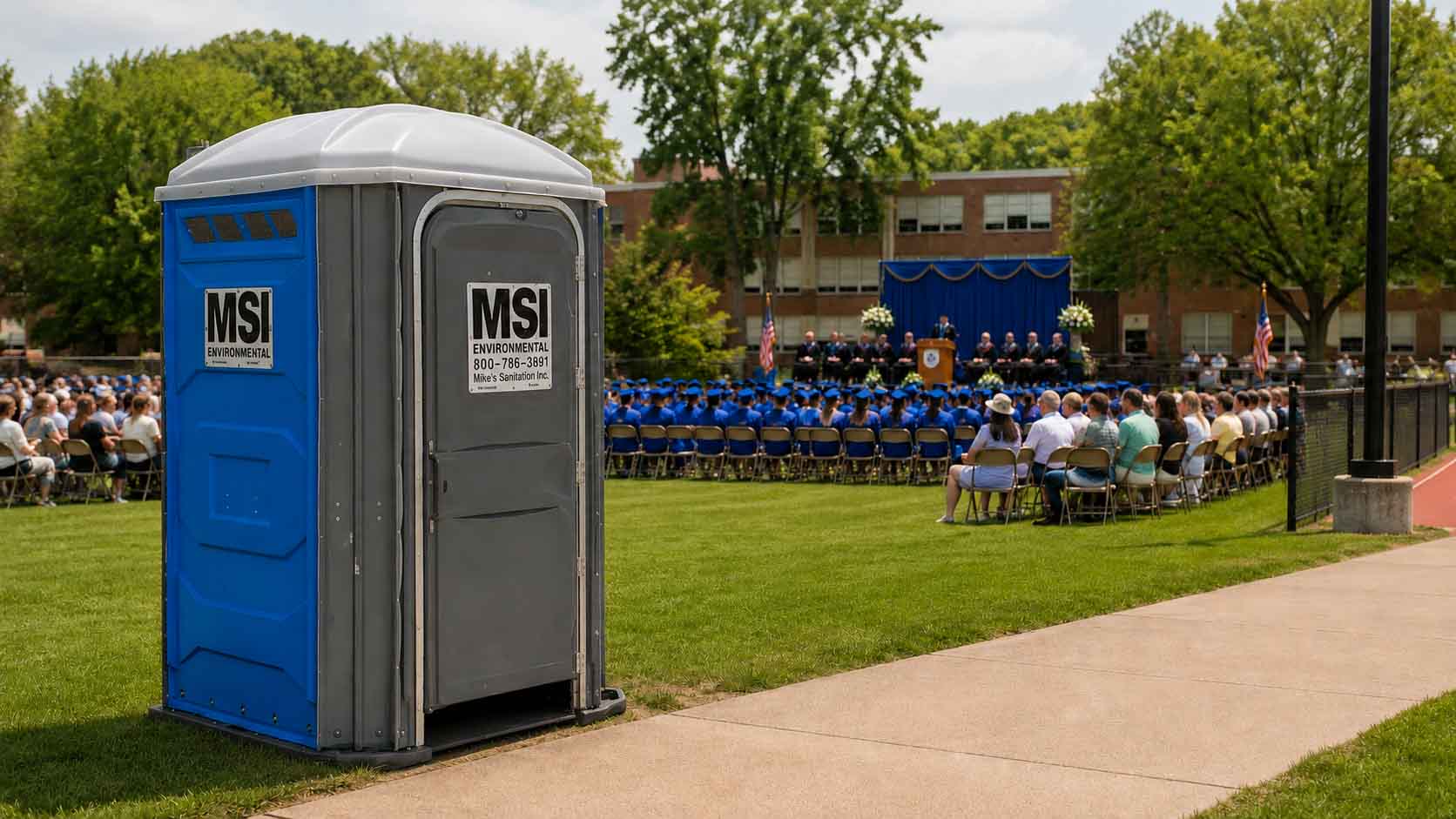 Portable restroom at an outdoor graduation celebration